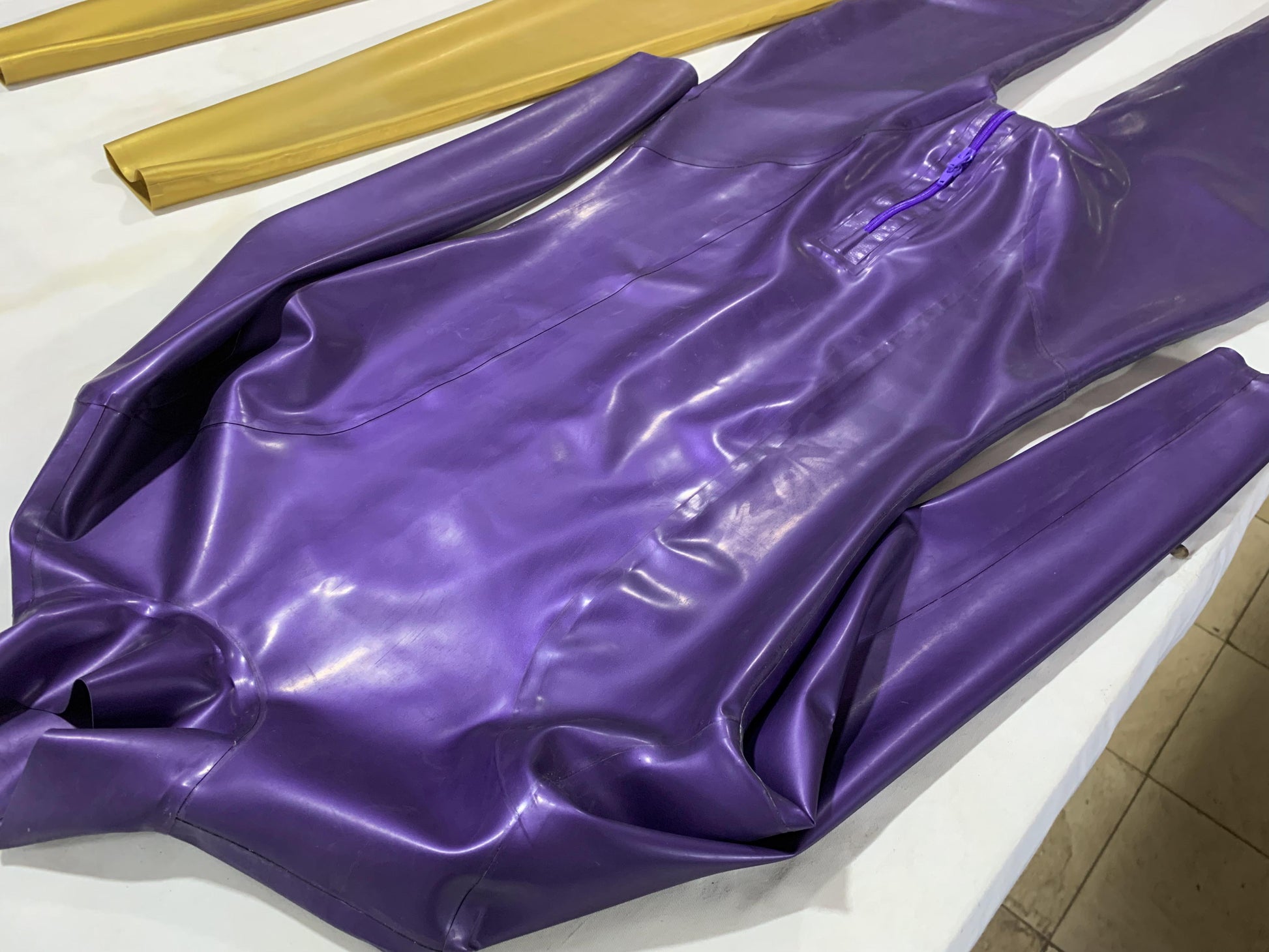 a latex bodysuit zipper crotch