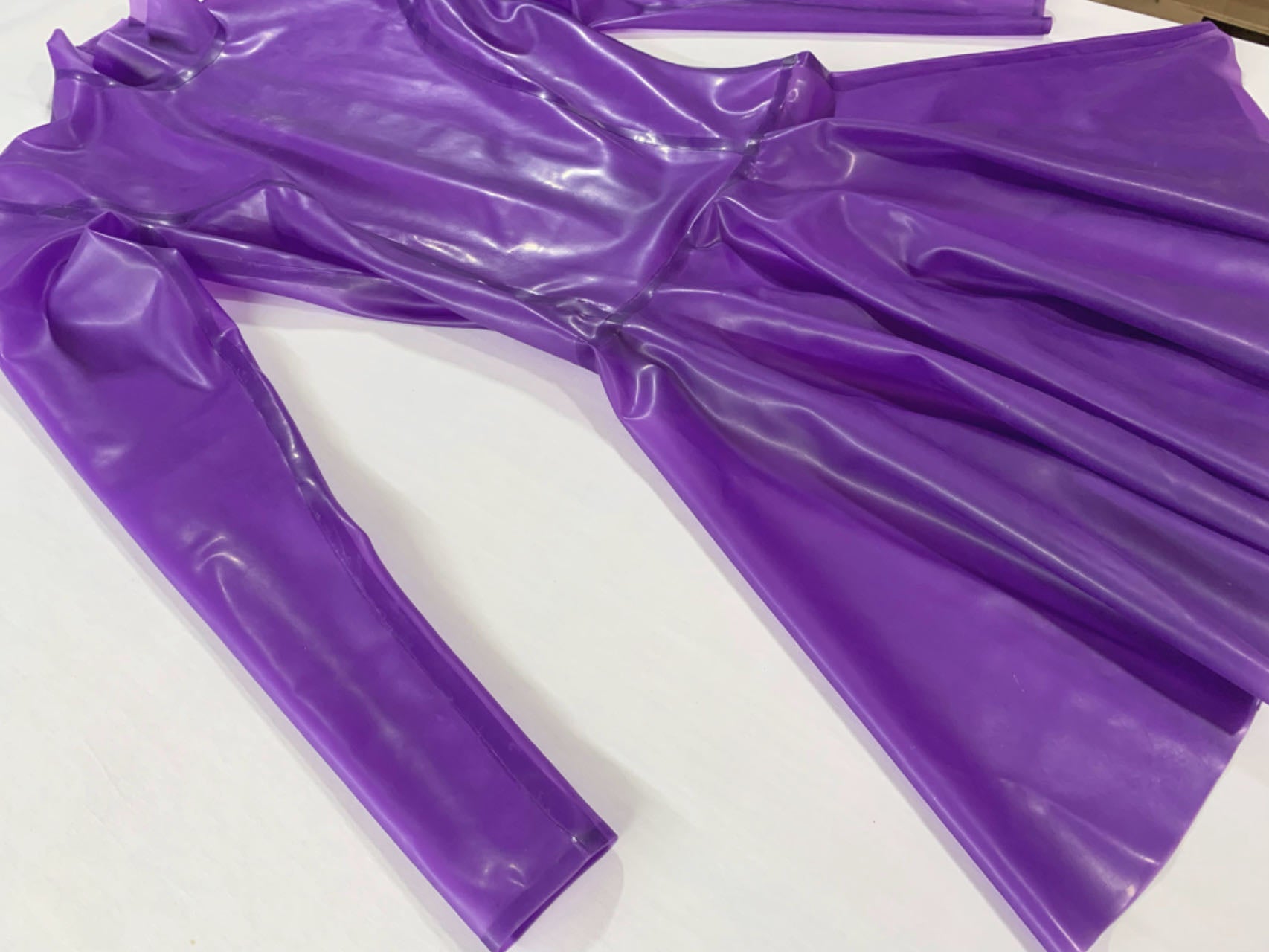 a purple long sleeve latex dress