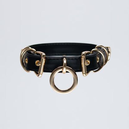 black faux leather o ring collar choker with polished gold alloy buckles on model neck front view