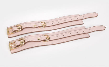 a pink Wrist and Ankle Cuffs Leather Sex Cuffs