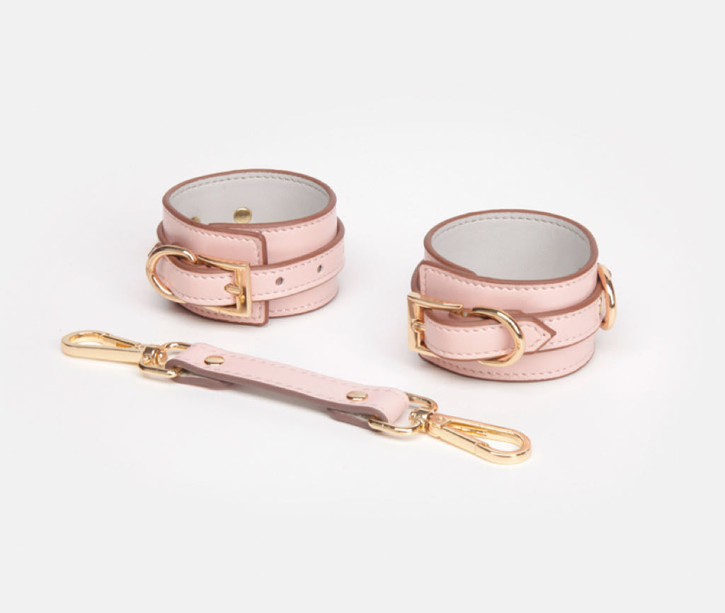 a pink Wrist and Ankle Cuffs Leather Sex Cuffs