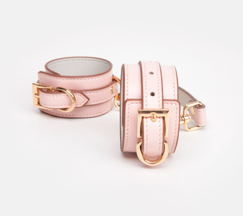 a pink Wrist and Ankle Cuffs Leather Sex Cuffs