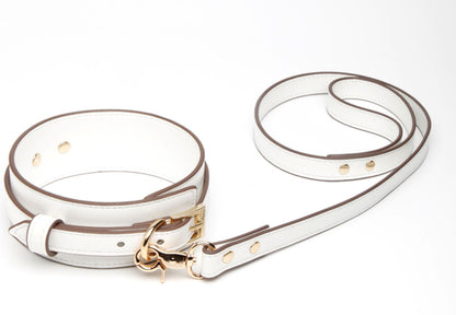 a white leather collar and leash set