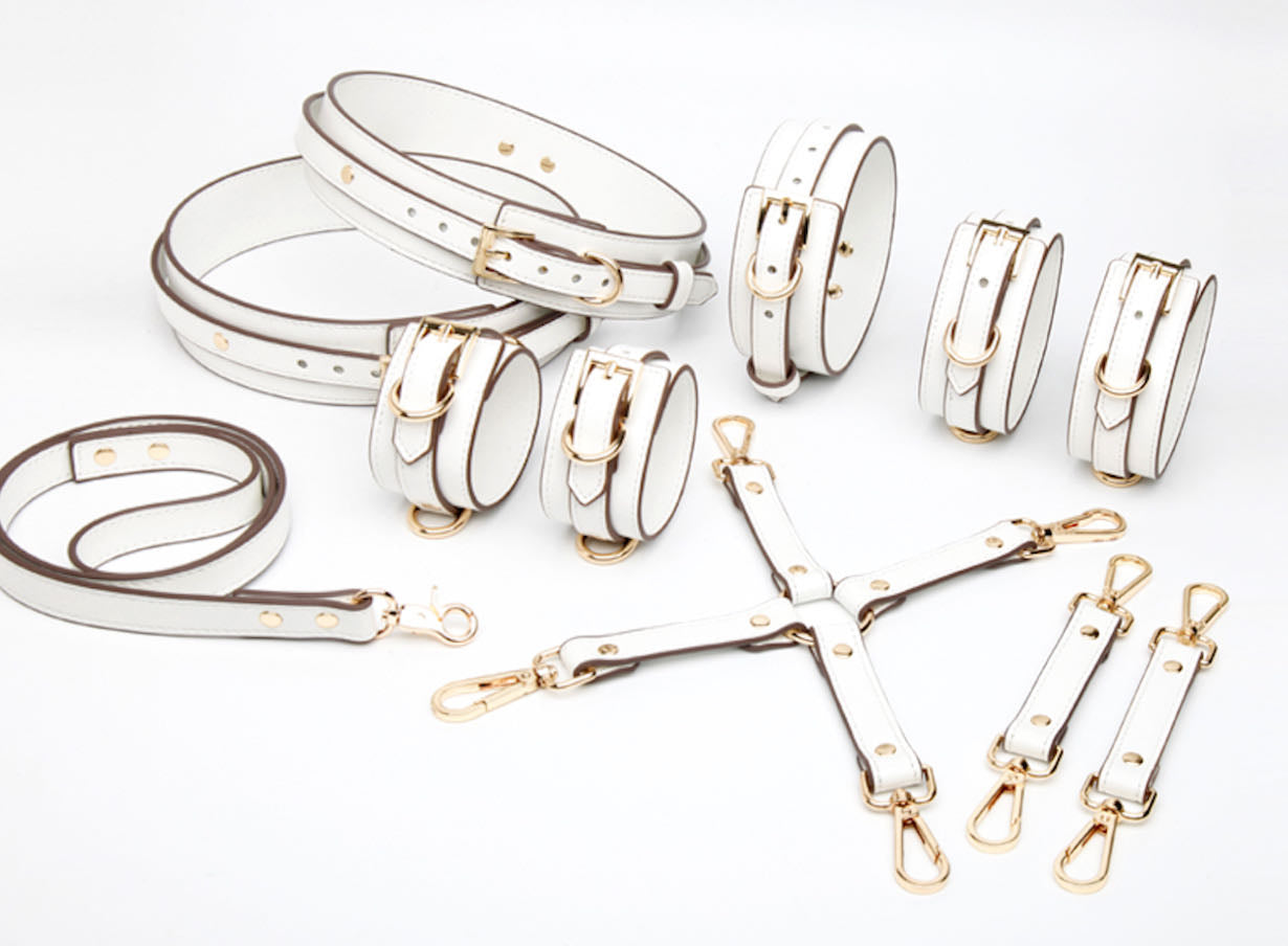 a white leather bondage sets