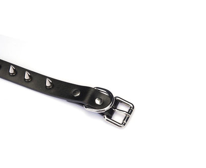 a black spiked choker with ring