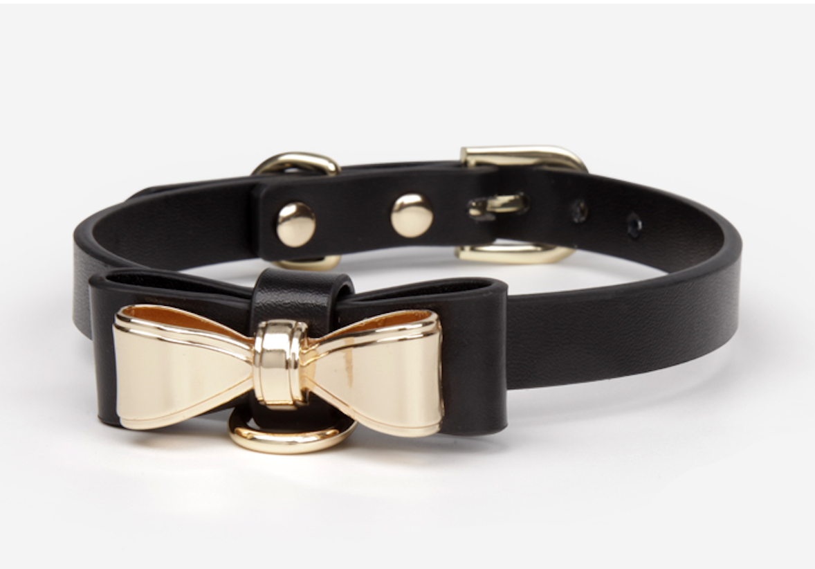 a black sex collar and leash with bow