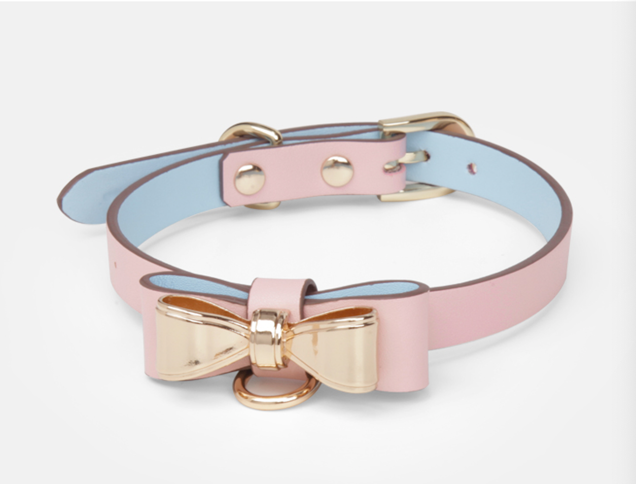 a pink sex collar and leash with bow