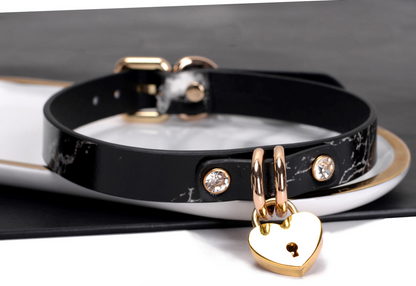 a black leather heart lock collar