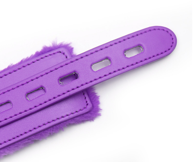 a purple leather bondage collar and leash set