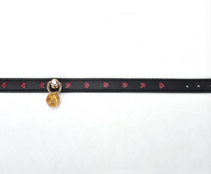 a black Bondage Day Collar with red heart