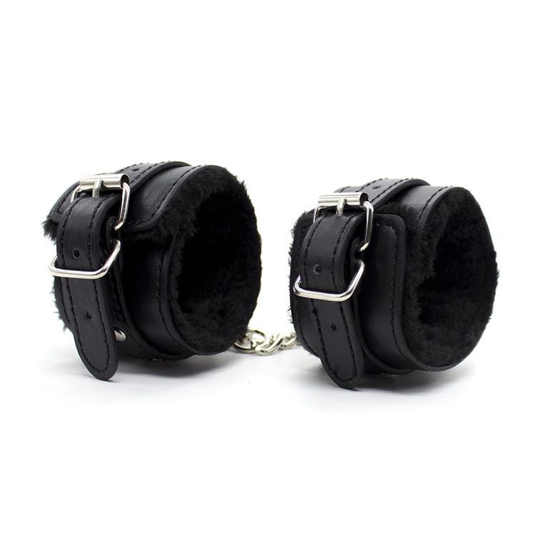 a black furry handcuffs