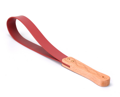 a red Spanking Paddles for Adults with wood handle