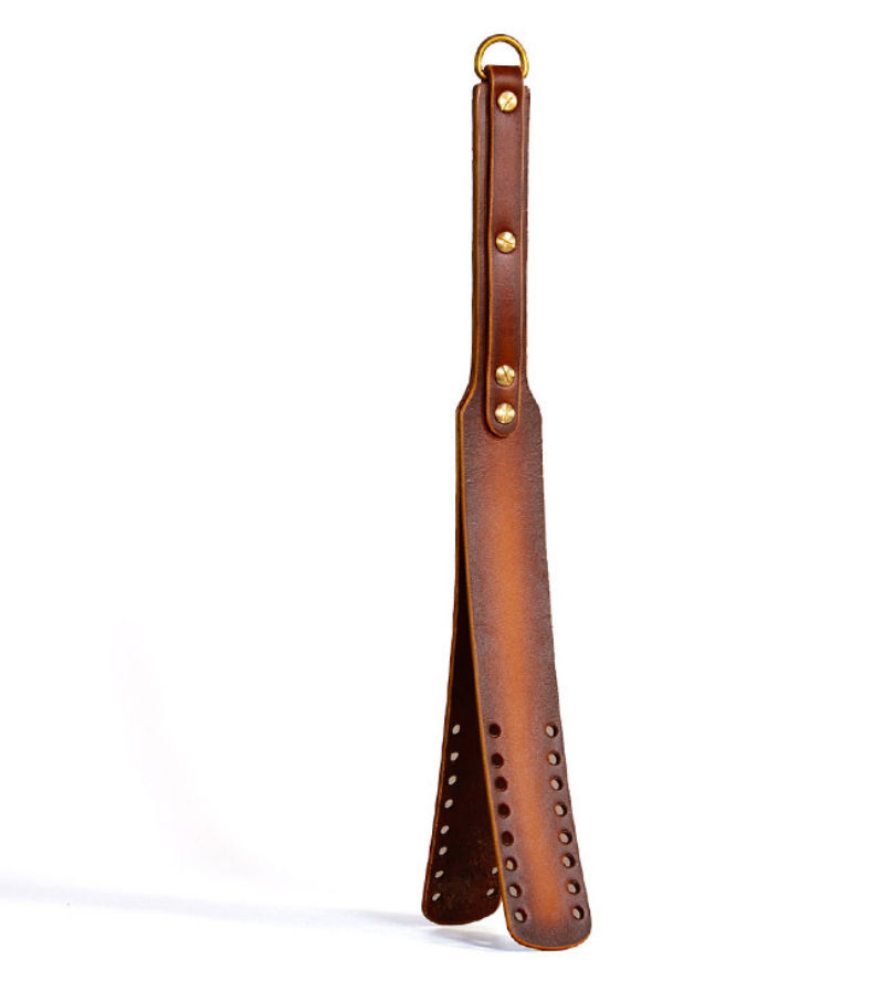 a Spanking Paddle with Holes