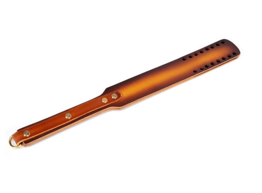 a Spanking Paddle with Holes