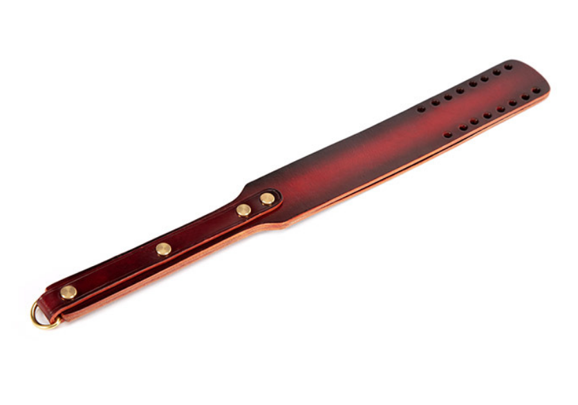 a Spanking Paddle with Holes