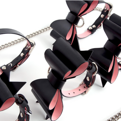 a black and pink bondage cuff