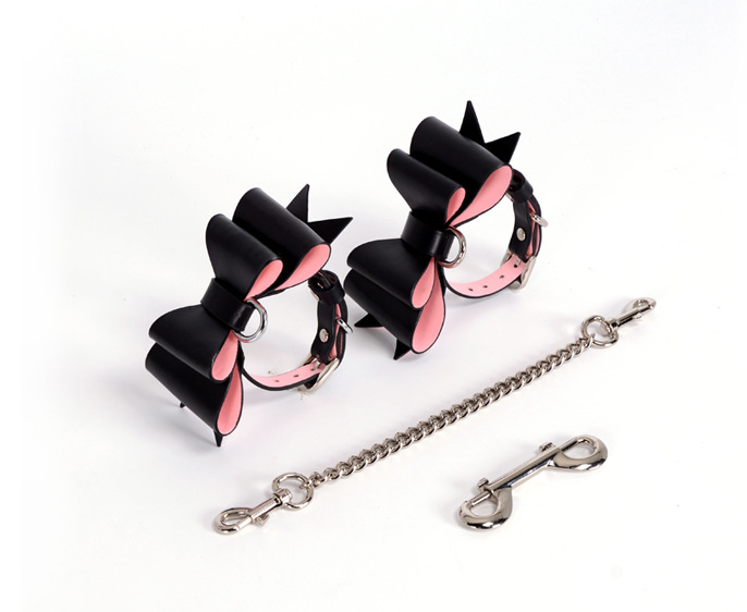 a black and pink leather handcuffs